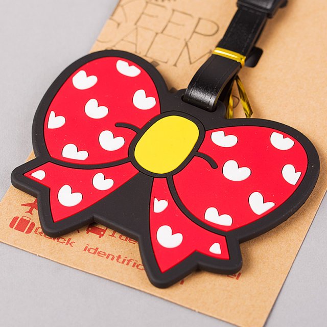 red bow tie luggage tag, luggage compartment luggage tag